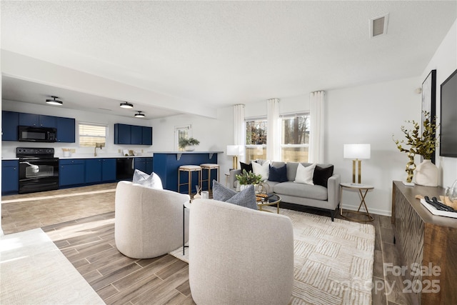 living room with a textured ceiling