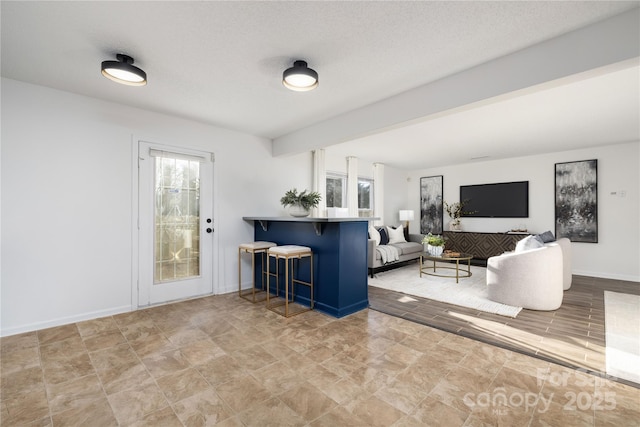 living room with a textured ceiling