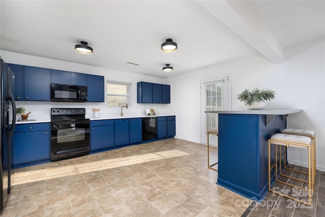 kitchen featuring a breakfast bar, black appliances, beam ceiling, blue cabinets, and sink