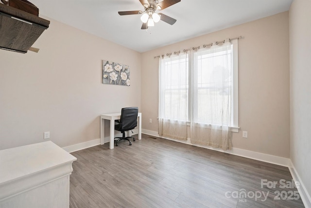 home office with ceiling fan and wood-type flooring