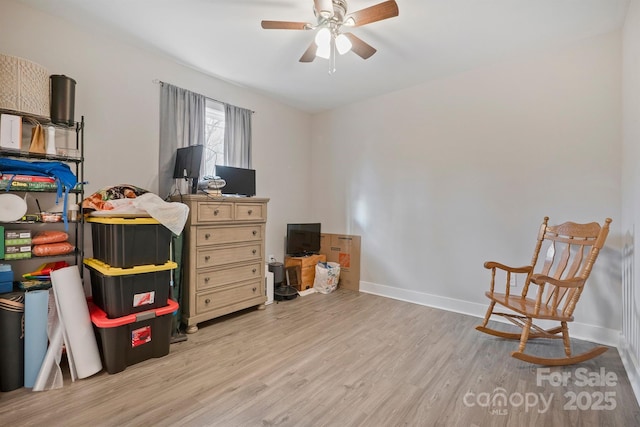 interior space featuring ceiling fan and light wood-type flooring