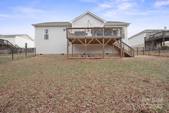 back of property featuring a lawn and a deck