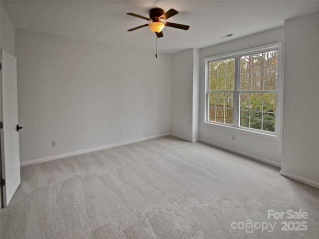 carpeted empty room with ceiling fan