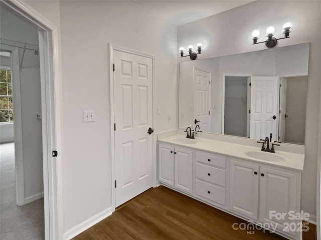 bathroom featuring vanity and hardwood / wood-style flooring