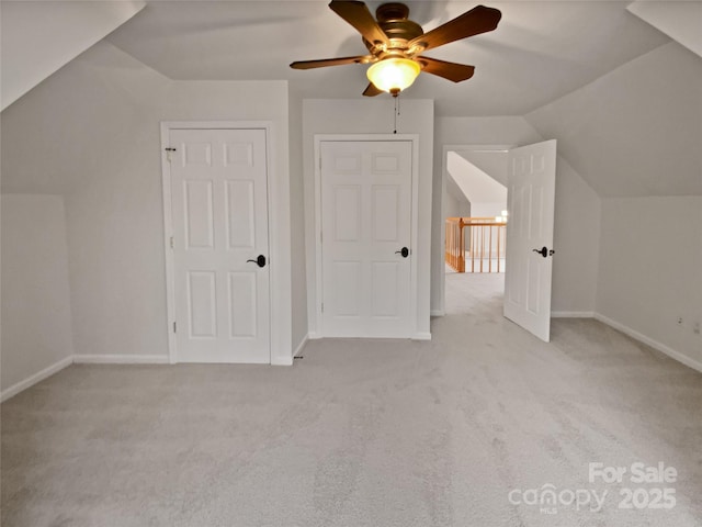 bonus room featuring lofted ceiling, light colored carpet, and ceiling fan