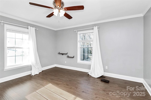 empty room with ceiling fan, dark hardwood / wood-style floors, and crown molding