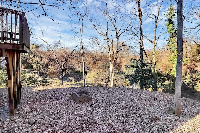 view of yard with an outdoor fire pit