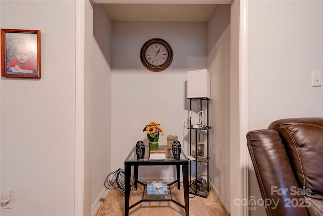 hall with light carpet and baseboards