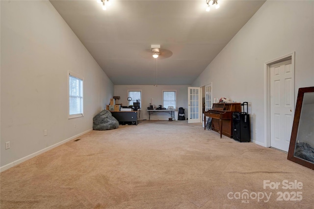 miscellaneous room featuring carpet, high vaulted ceiling, and baseboards