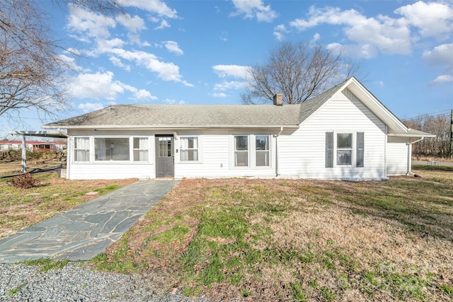 ranch-style house with a front yard