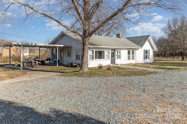 view of front of home featuring a carport