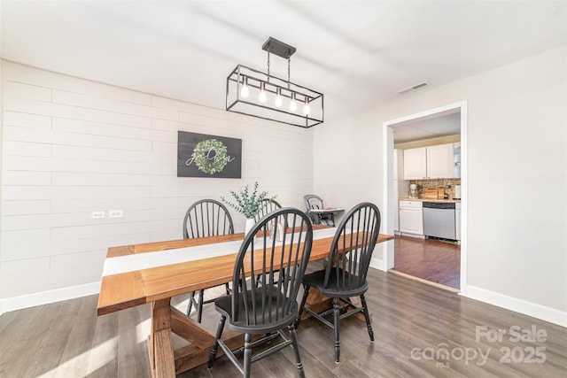 dining room with dark hardwood / wood-style floors