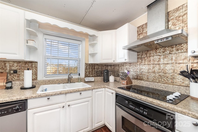 kitchen featuring wall oven, wall chimney range hood, stainless steel dishwasher, white cabinets, and sink