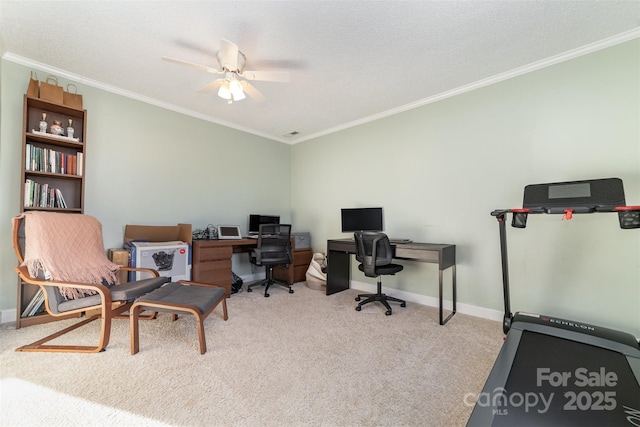 carpeted office space featuring ceiling fan, a textured ceiling, and ornamental molding