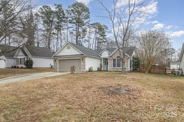 single story home featuring central air condition unit, a front yard, and a garage