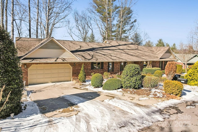 ranch-style house featuring a garage