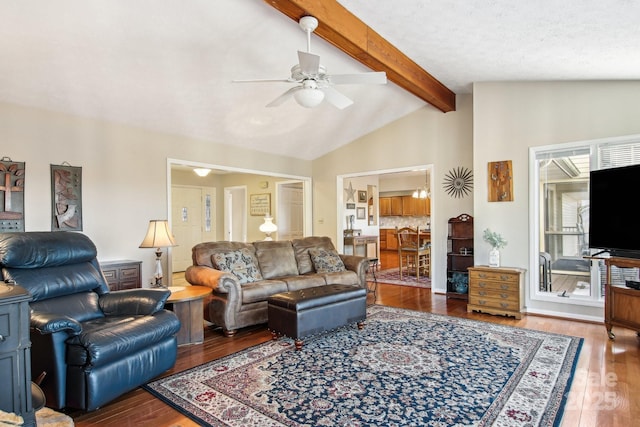 living room featuring ceiling fan, wood-type flooring, and lofted ceiling with beams