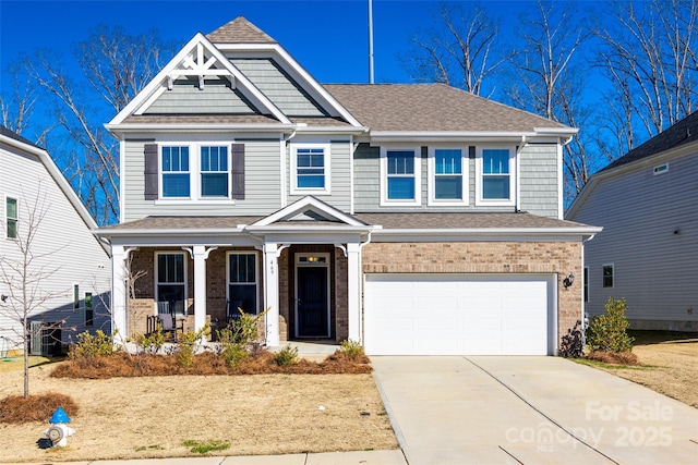 view of front of house featuring covered porch and a garage