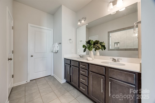 bathroom featuring walk in shower, vanity, and tile patterned floors