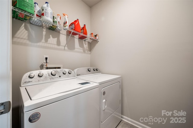 laundry room featuring independent washer and dryer and tile patterned flooring