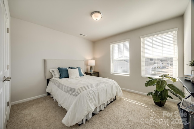 bedroom with light colored carpet