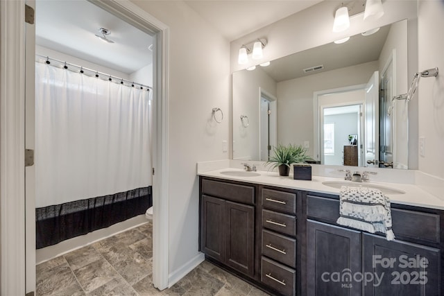 full bathroom with toilet, vanity, and shower / bath combination with curtain