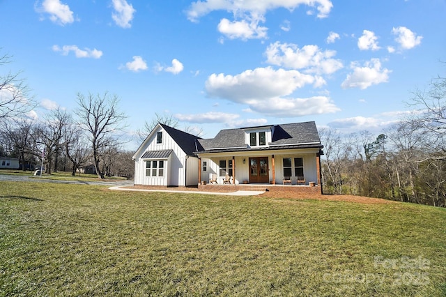 view of front of property with covered porch and a front lawn