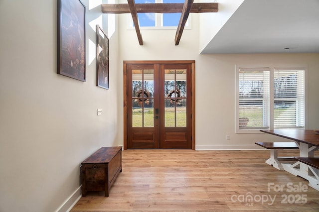 entrance foyer with french doors and light wood-type flooring