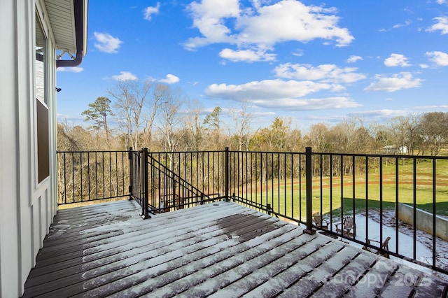 wooden terrace with a yard