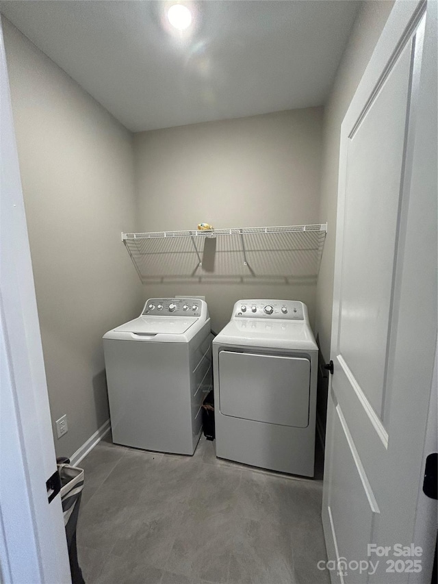 laundry area with washing machine and dryer