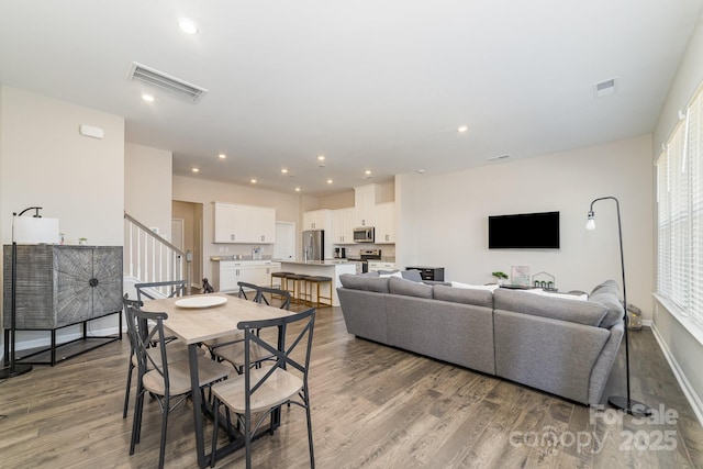 dining room with light hardwood / wood-style floors