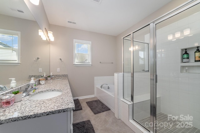 bathroom featuring vanity, a wealth of natural light, and separate shower and tub