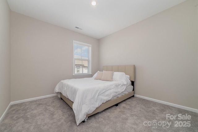 bedroom featuring light colored carpet