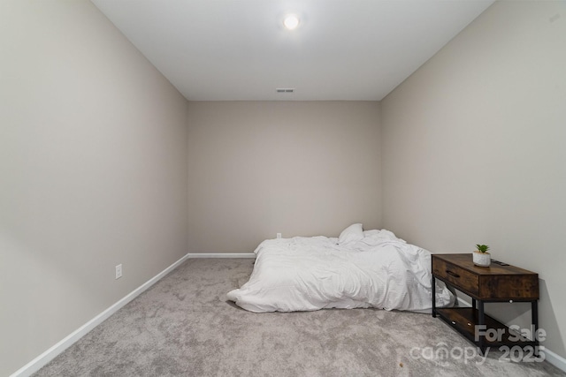 bedroom with light colored carpet