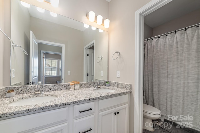 bathroom with vanity and toilet