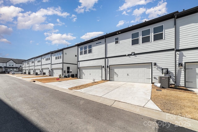 exterior space featuring central AC and a garage