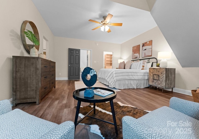 bedroom with baseboards, a ceiling fan, and wood finished floors