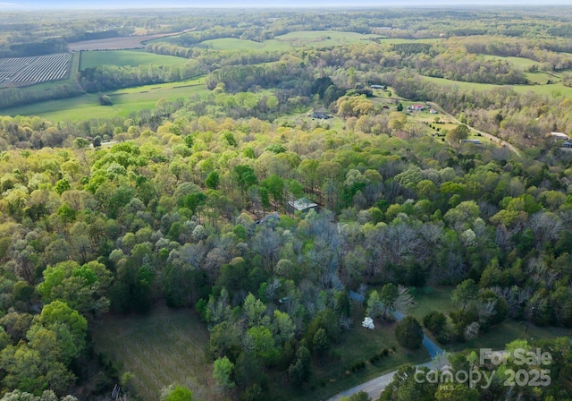 aerial view with a wooded view