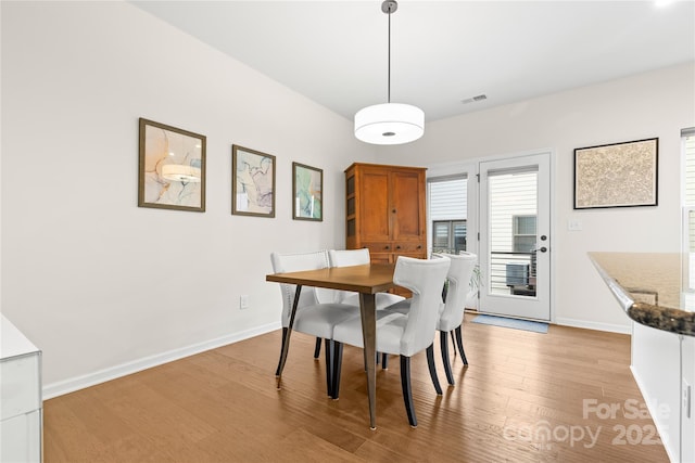 dining space featuring light hardwood / wood-style flooring