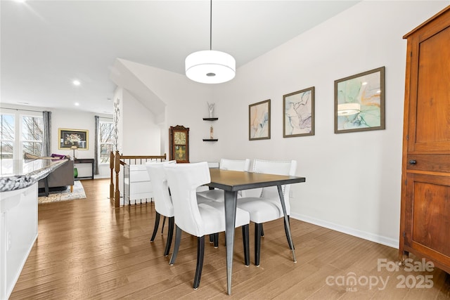 dining space featuring wood-type flooring