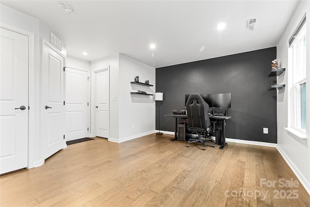 office with light hardwood / wood-style flooring