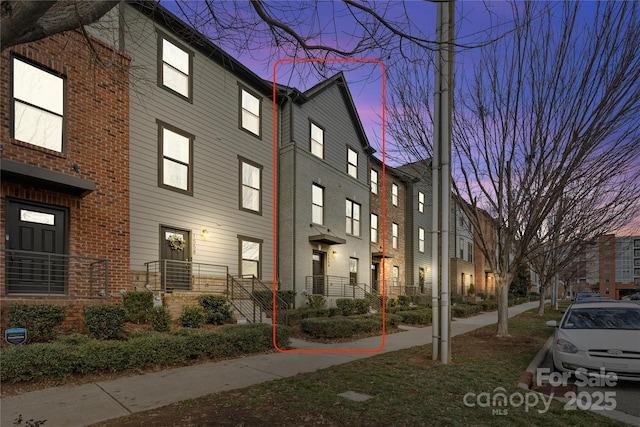 view of outdoor building at dusk