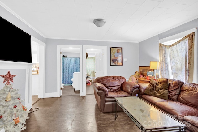 living room featuring dark wood-type flooring and ornamental molding