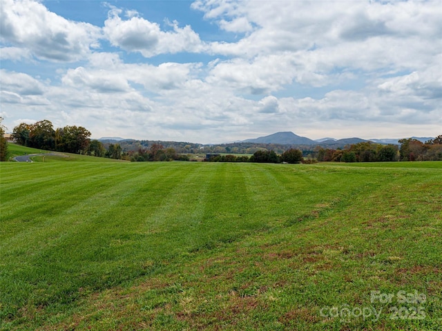 mountain view featuring a rural view