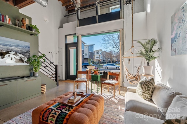 living room with a towering ceiling