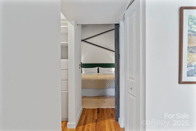 hallway with light hardwood / wood-style flooring