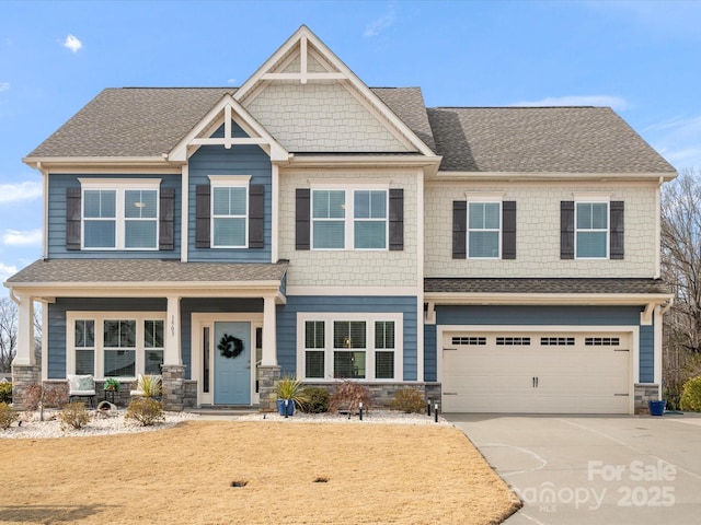 craftsman house with a garage and a porch