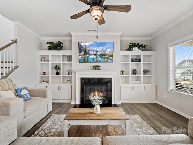 living room featuring crown molding, ceiling fan, and dark hardwood / wood-style flooring