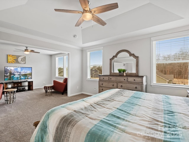 bedroom with a raised ceiling, ornamental molding, carpet, and ceiling fan