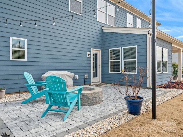 view of patio / terrace featuring a fire pit